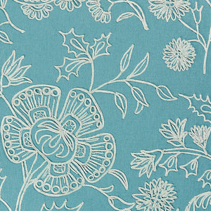 Light blue floral and paisley pattern on a teal/sea foam green background