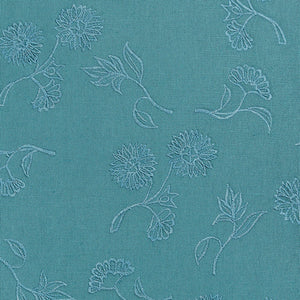 Teal throw pillow with tonal floral embroidery pattern