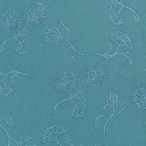 Teal throw pillow with tonal floral embroidery pattern