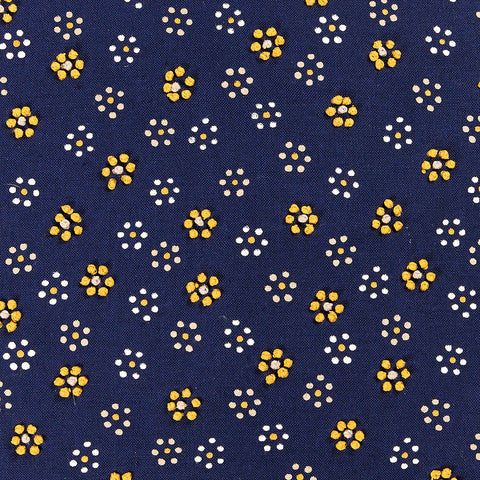 Navy blue fabric with small yellow and white polka-dotted floral pattern