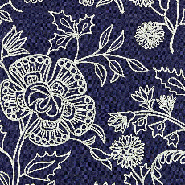 Square throw pillow in navy and light blue hues with a flowing floral design.