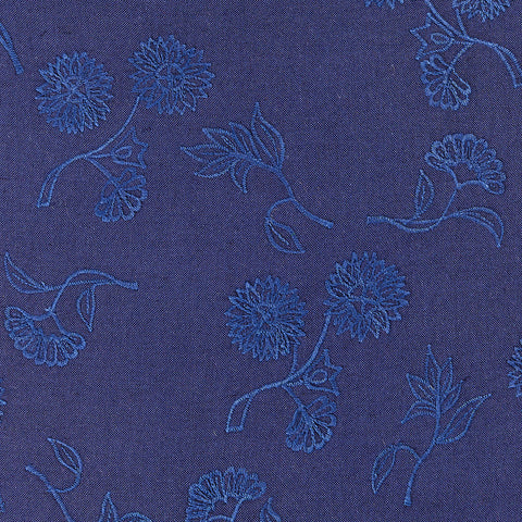 Tonal navy throw pillow with navy embroidered floral motif