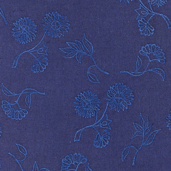 Tonal navy throw pillow with navy embroidered floral motif