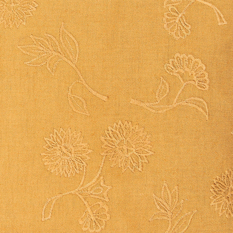 Textured fabric with floral pattern on a mustard yellow background